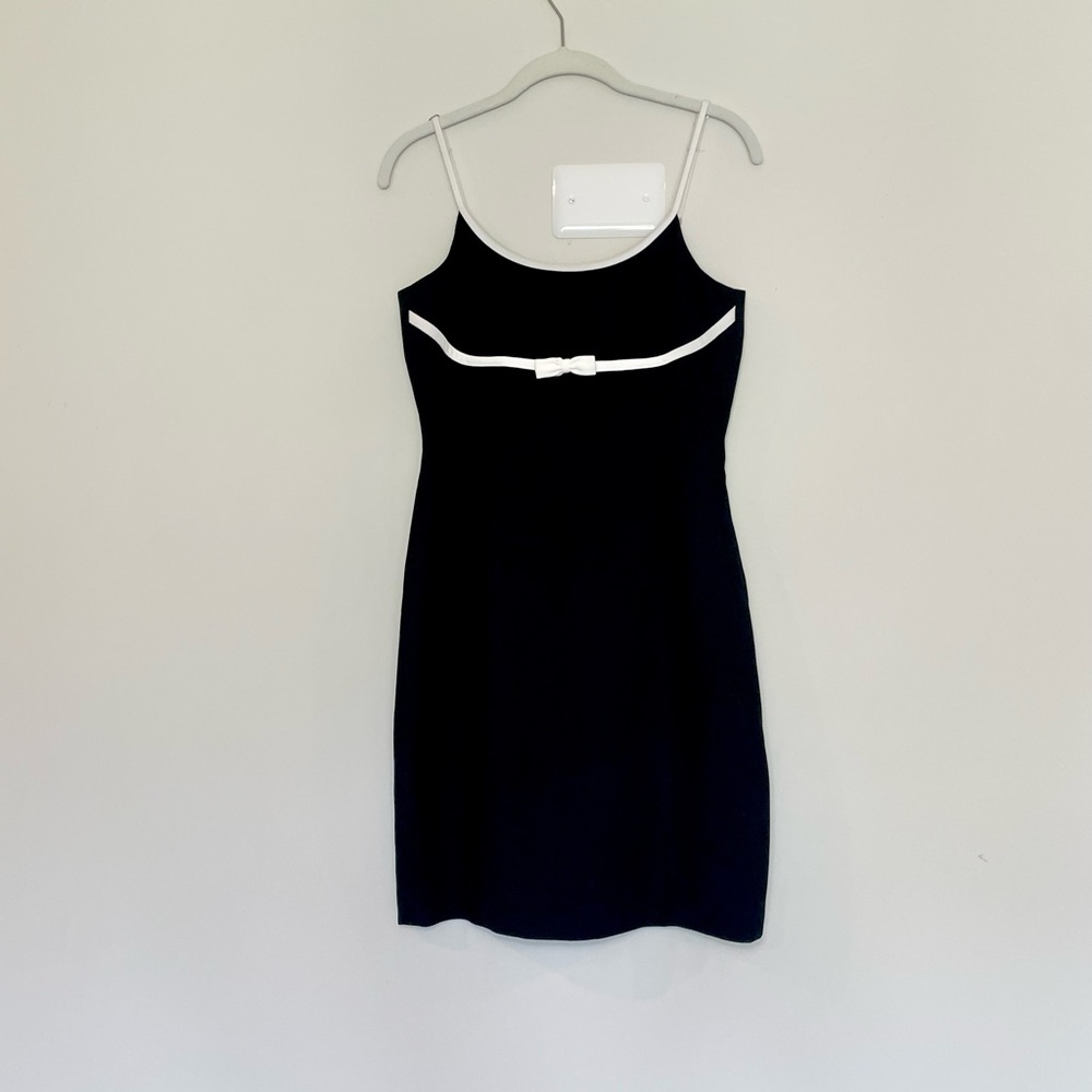 Elegant Black Bebe Mini Dress with White Bow Trim
